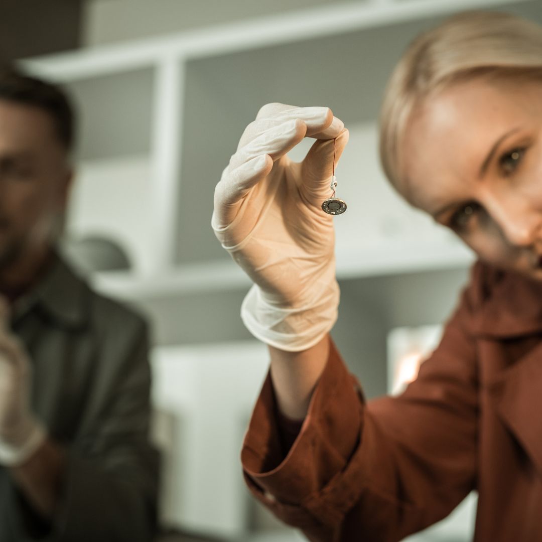 Woman finding listening device