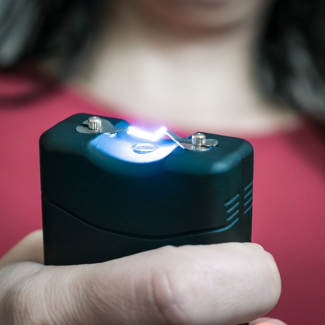 Woman holding stun gun