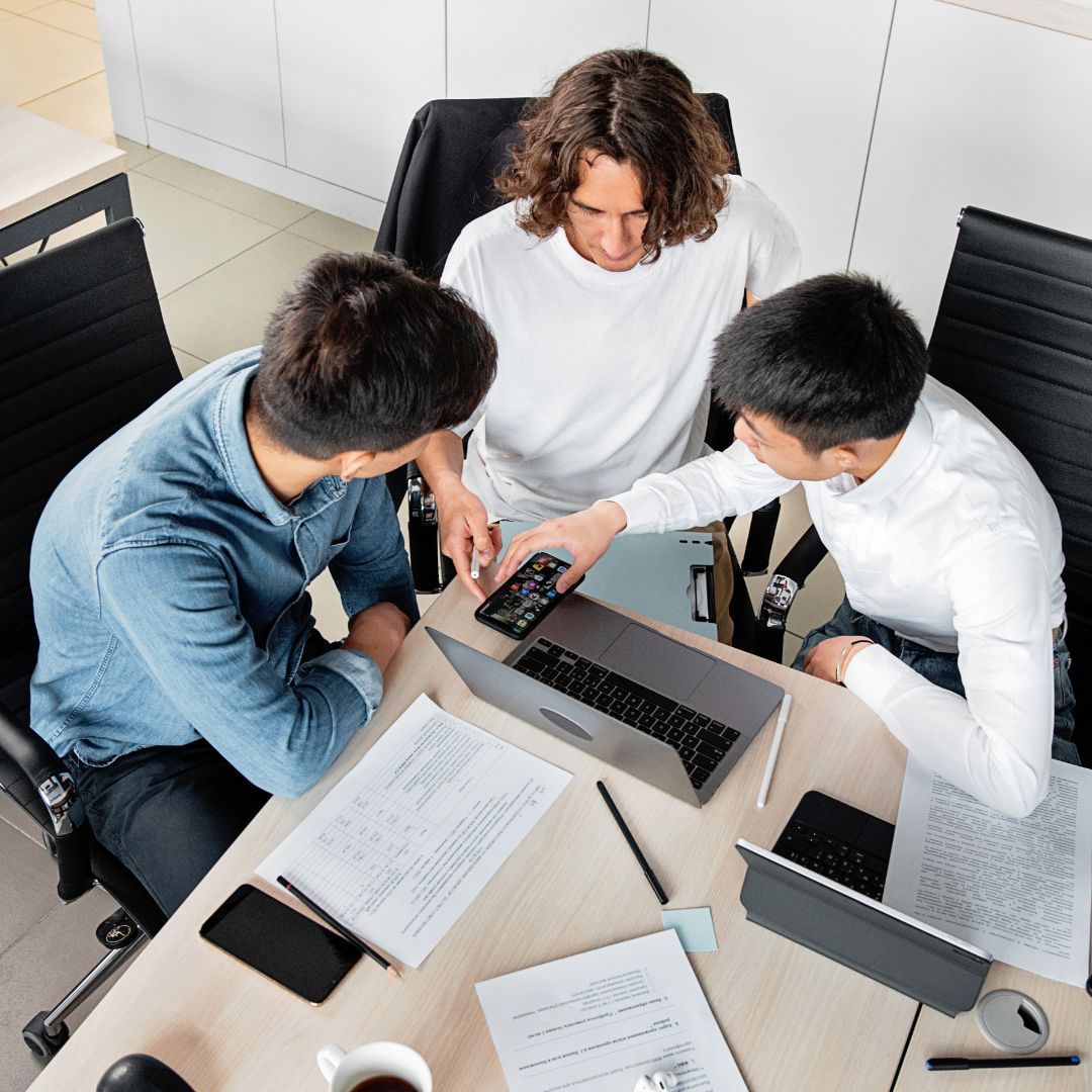 group of employees at desk