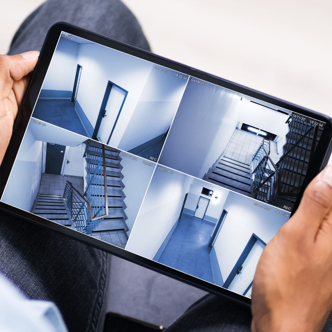 watching surveillance on tablet