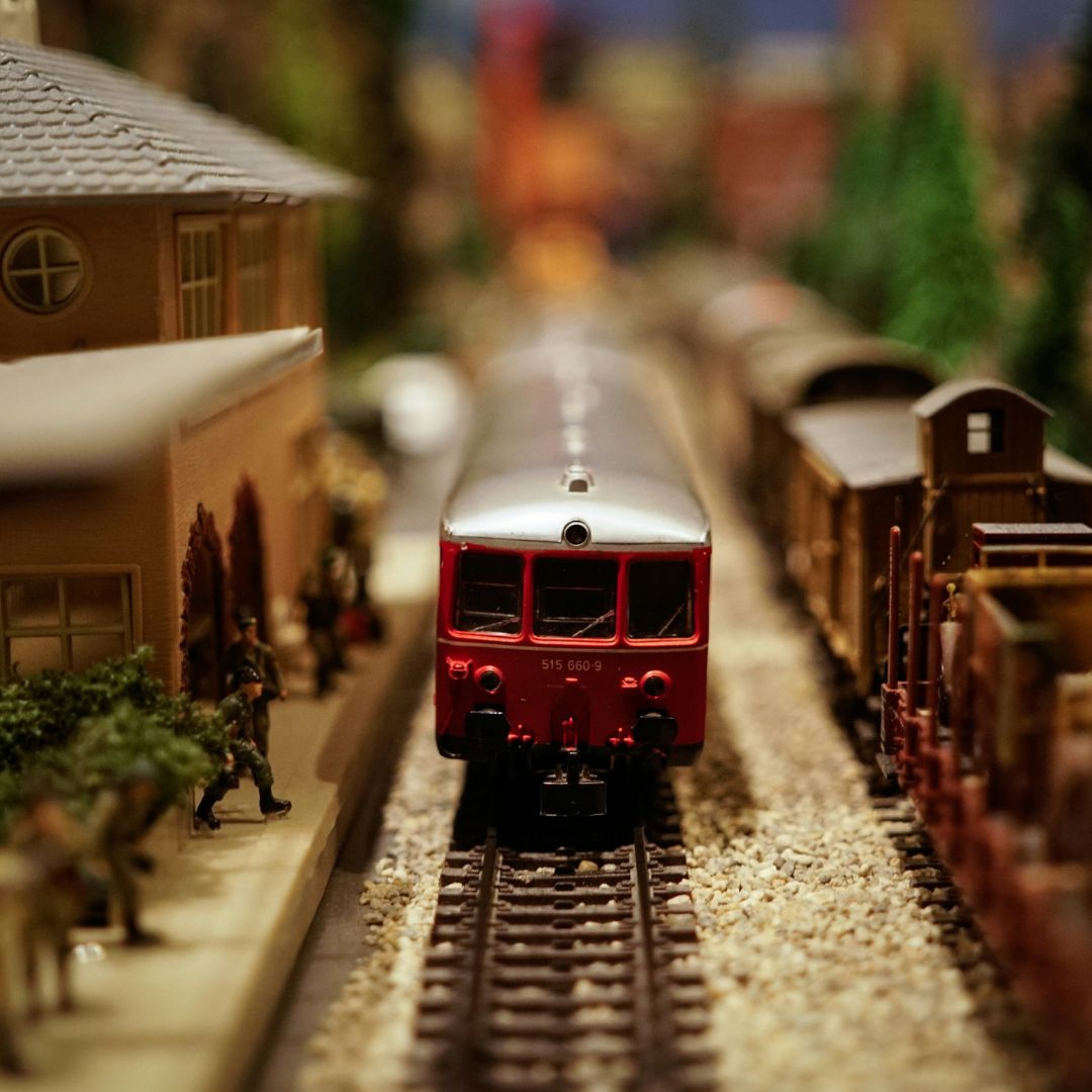 model train at station, passengers ready to board