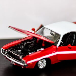 red diecast car with hood open