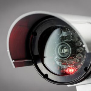 A security camera with a red light