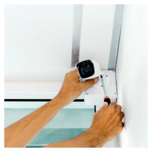 a person installing a security camera