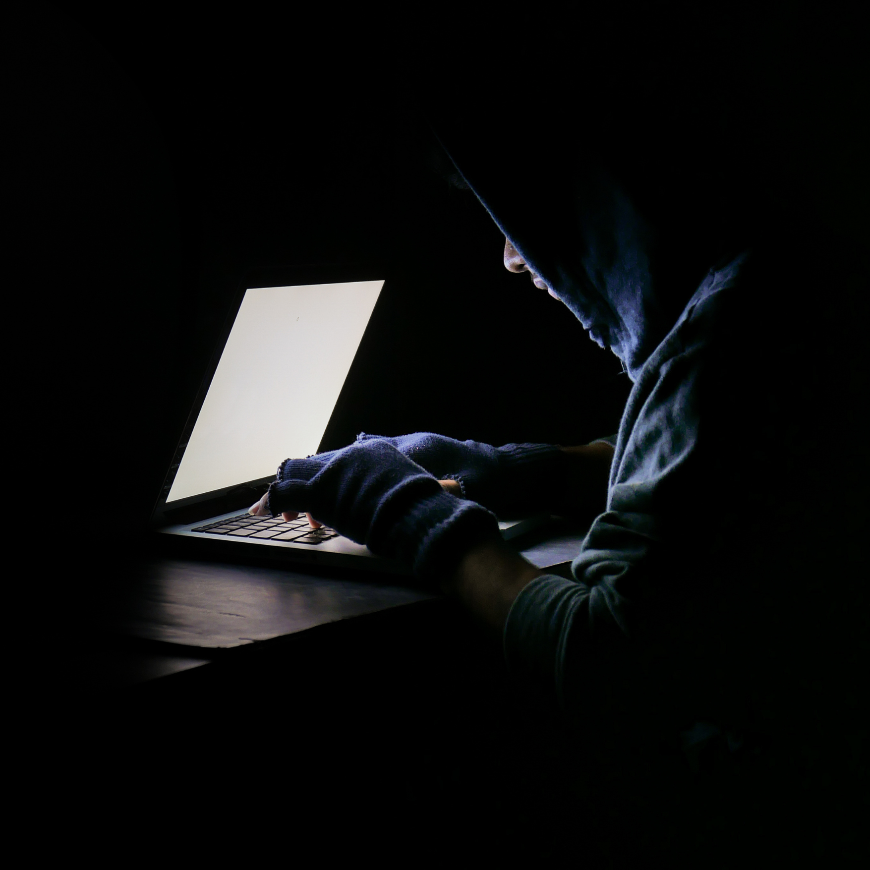 hacker/spy on computer in dark room